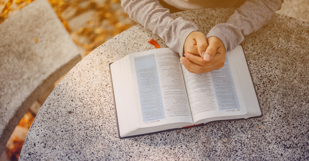 Woman praying, reading the Bible. What Does the Bible Say About Agnosticism?