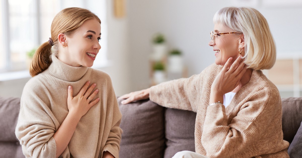 Mentor older and younger woman talking