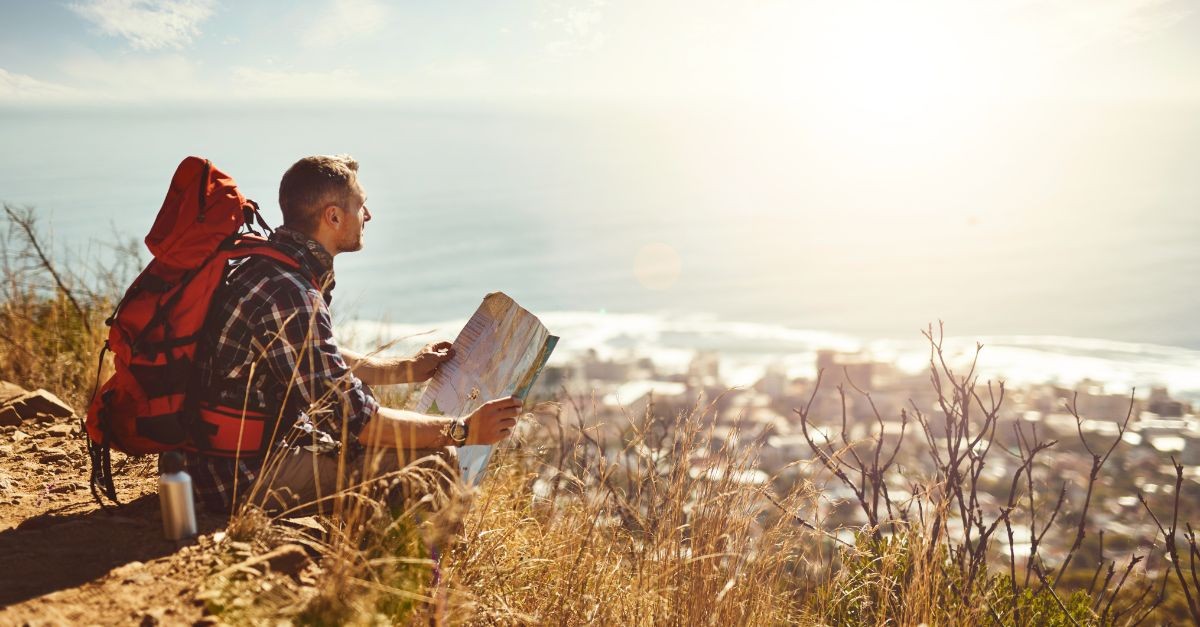 Man knelt down at the edge of a cliff with a map; what is the difference between knowing about Jesus and knowing Him peronally?